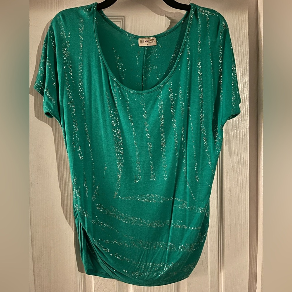 Green short sleeve top with cinched sides and silver sparkly detail on front